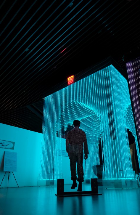 Team member in immersive light installation